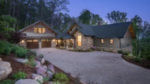 living stone fletcher home with custom brick drive
