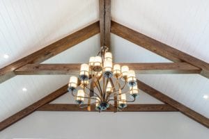 Large chandelier suspended from vaulted ceiling